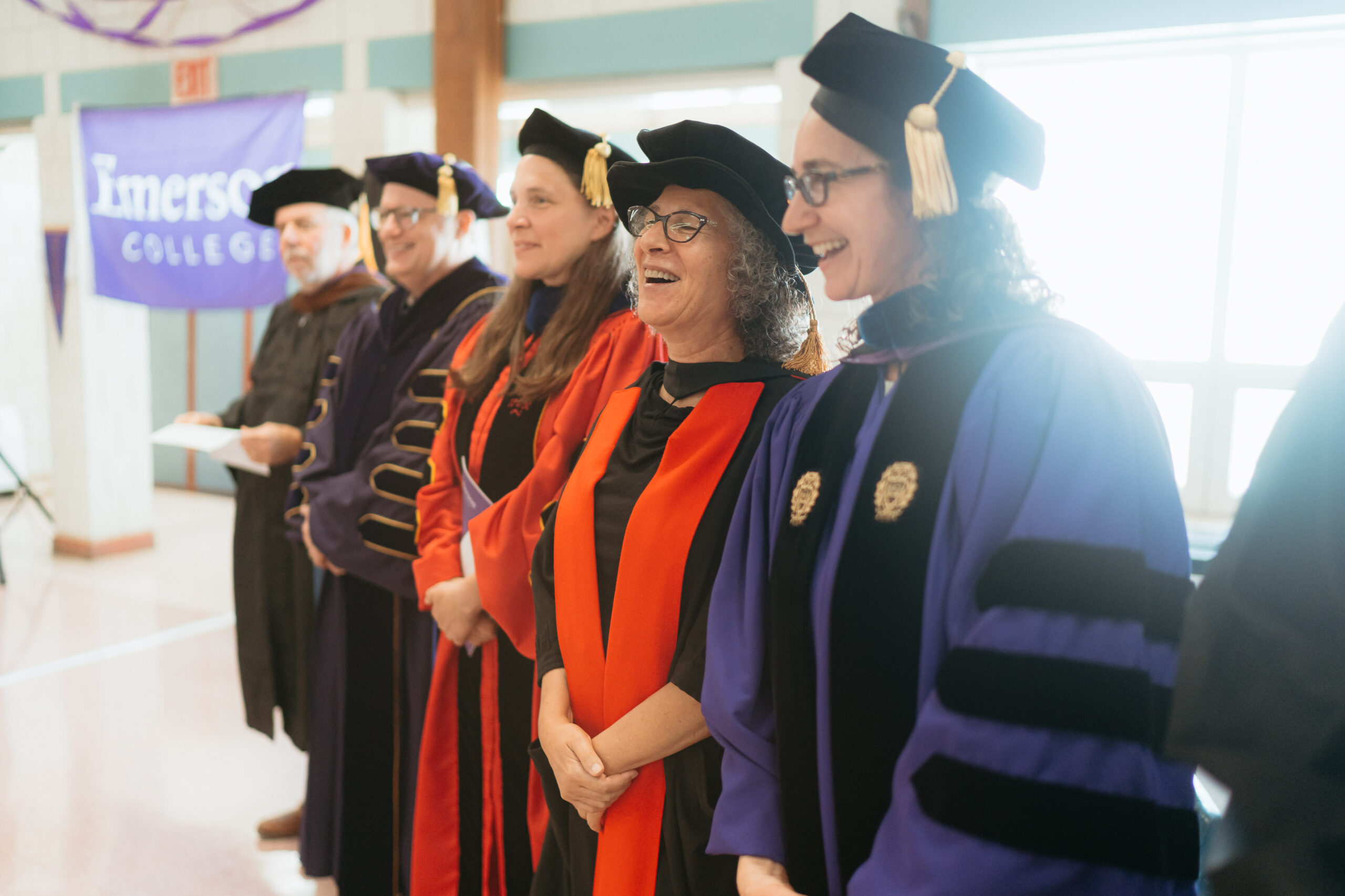 A row of Emerson College leaders, including Mneesha Gellman, Provost Alex Socarides, and President Jay Bernhardt