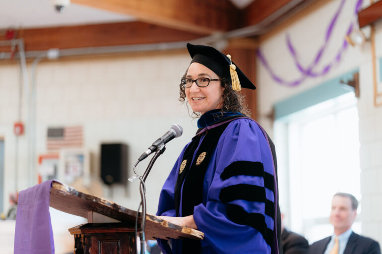 Mneesha Gellman addressing the audience at the 2025 Emerson Prison Initiative commencement ceremony